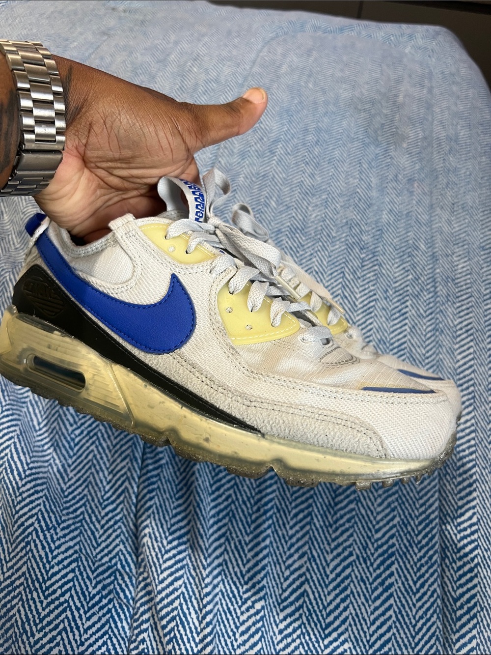 Nike White Sneaker with Blue Swoosh and Yellow Accents